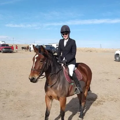 Ainninn Realta under saddle with her rider in show attire
